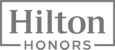 The image shows the Hilton Honors logo in grayscale with the word "Hilton" above "Honors" enclosed in a rectangular border.